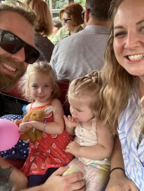 Miesha, Matt and the girls on a children's train in Braga.